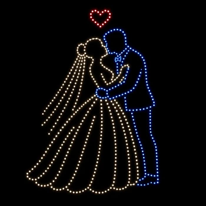 Bride and groom kiss wedding drone show figure made from glowing dots